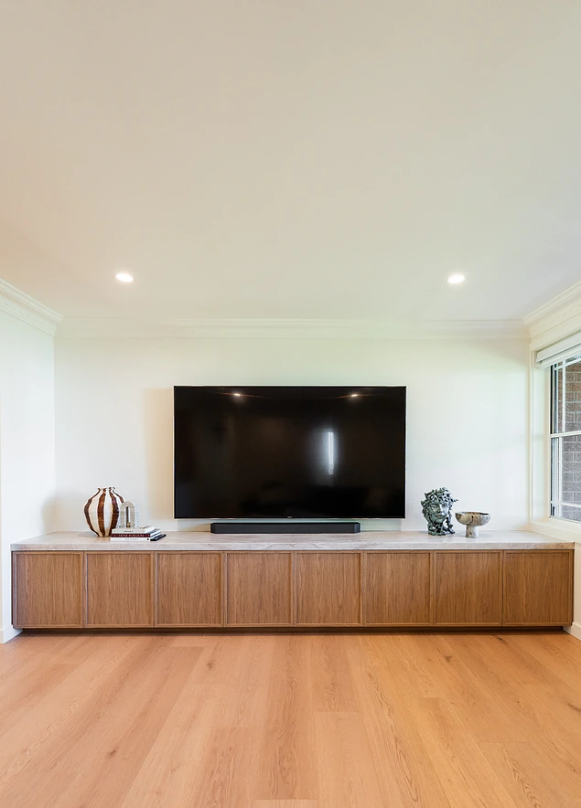 Custom low timber entertainment unit in a living room
